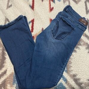 Hollister dark jeans with rips at the knees size 7